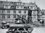 Black soldiers of the 761st Tank Battalion in front of M4 Sherman tank, 1944